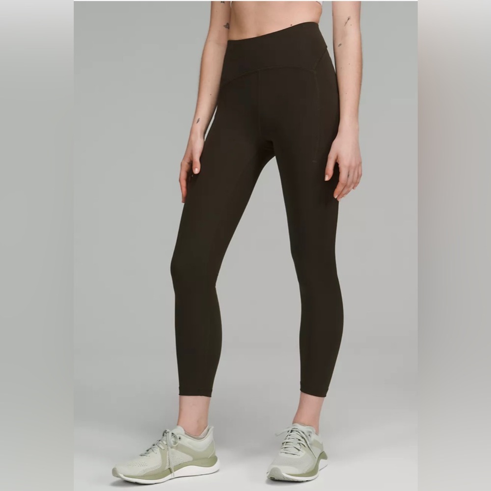 NEW with tags. POWER THRU HIGH-RISE TIGHT 25" in dark olive.